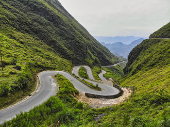 Scenic view of mountain road against sky