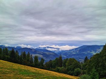 Scenic view of landscape and mountains against sky