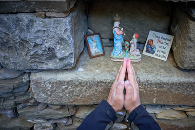 Low section of man standing on retaining wall