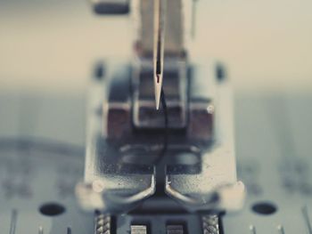 Close-up of water drops on metal wheel