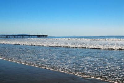 Scenic view of sea against clear blue sky