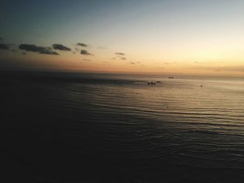 Scenic view of sea against sky at sunset