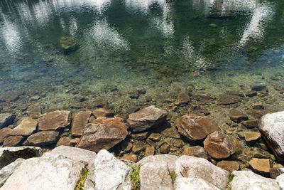 High angle view of stones in lake