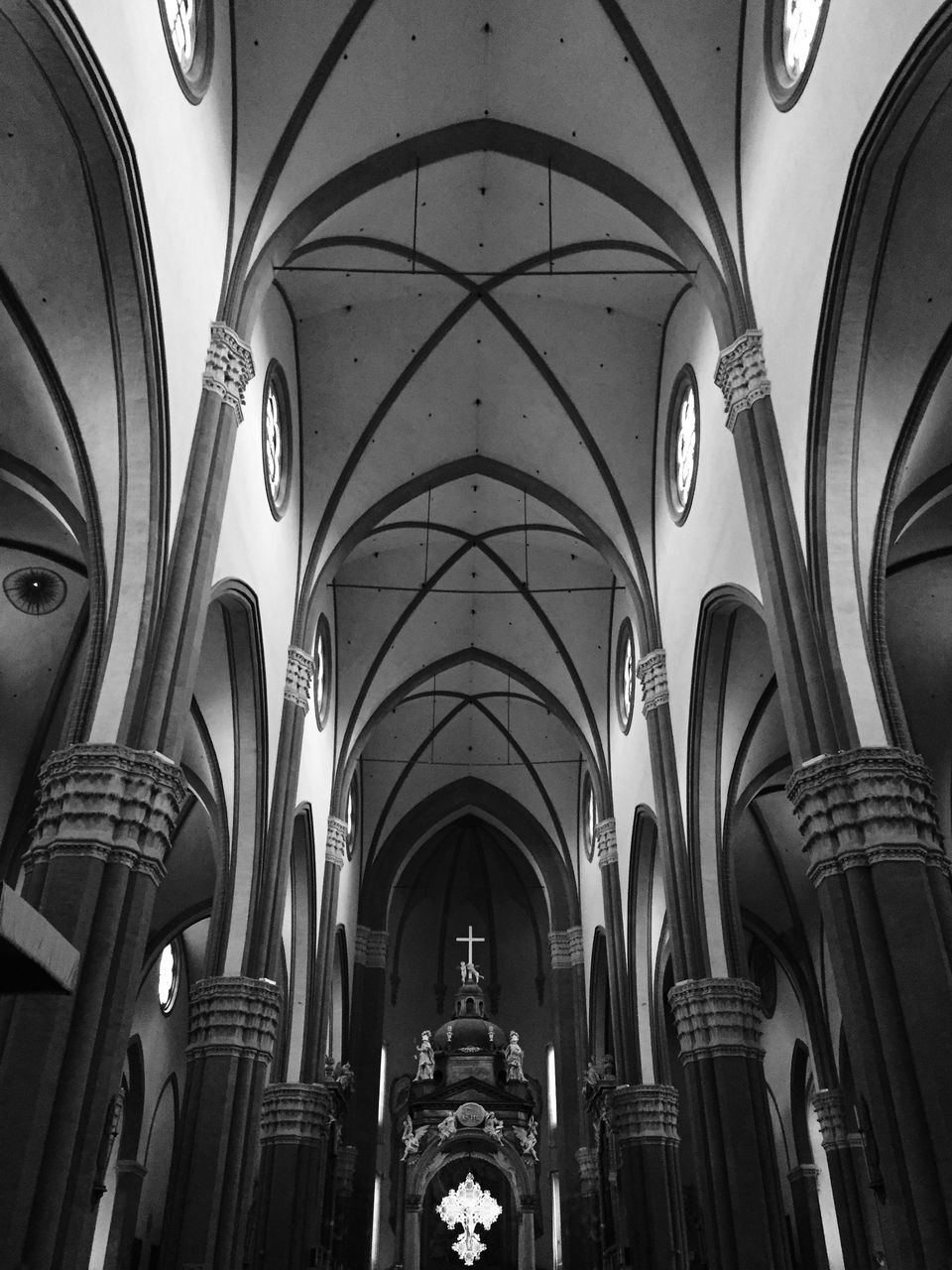 indoors, arch, architecture, built structure, ceiling, interior, church, place of worship, religion, architectural column, low angle view, architectural feature, history, spirituality, ornate, cathedral, travel, in a row