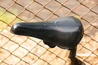 High angle view of bicycle on fence