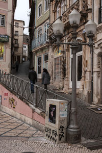 Rear view of man walking on street