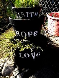 High angle view of text on potted plant in yard