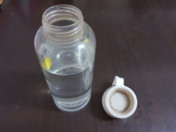 High angle view of glass of jar on table