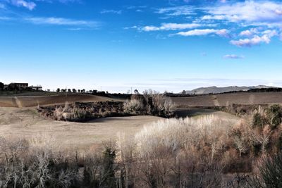 Scenic view of land against sky