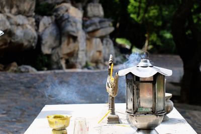 Close-up of religious equipment on table