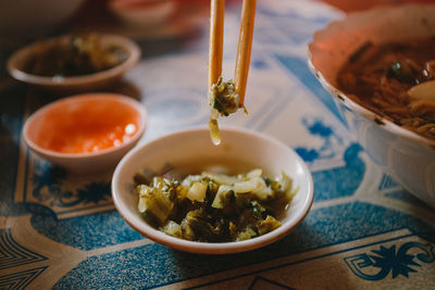 Close-up of food in chopstick