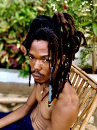 Low angle view of young woman sitting on hammock