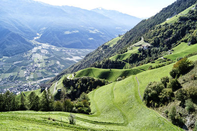 Scenic view of landscape and mountains against sky