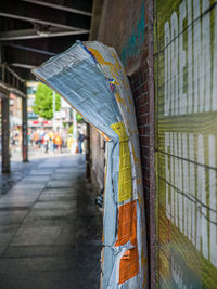 Close-up of metal fence against wall