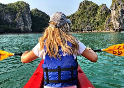 Woman kayaking in lake