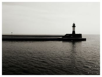 Distance shot of lighthouse against clear sky