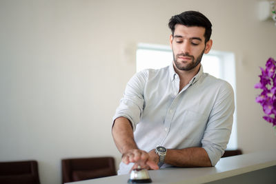 Young man looking at camera