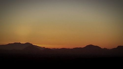 Scenic view of mountains at sunset