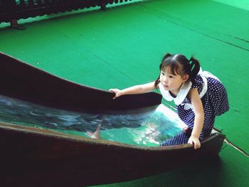 High angle view of girl playing on slide
