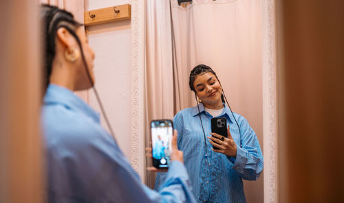 Side view of man using mobile phone