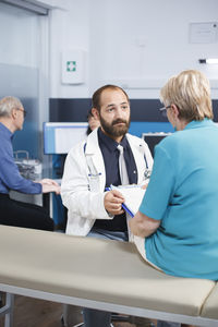 Portrait of doctor and female colleagues working in office