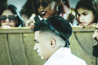 Close-up portrait of boy looking away outdoors
