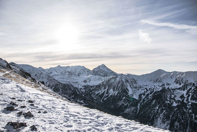 Scenic view of snowcapped mountains against sky