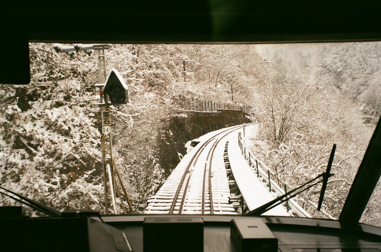 VIEW OF RAILROAD TRACKS BY WINDOW