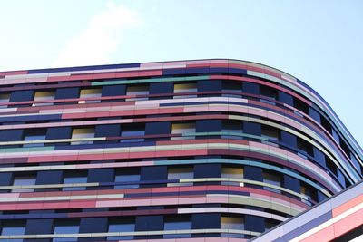 Low angle view of office building against sky