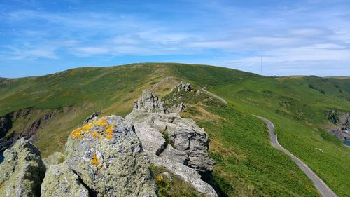 Scenic view of landscape against blue sky