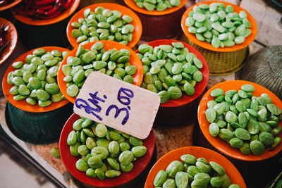 High angle view of food in plates with price tag at market stall