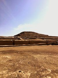 Built structure on landscape against clear sky