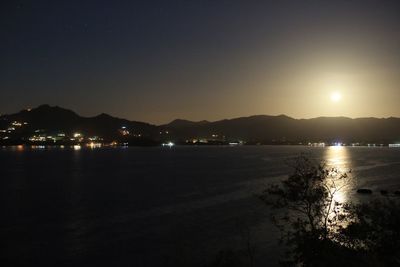 Scenic view of sea against sky at night
