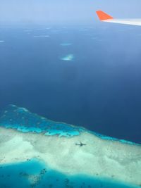 Scenic view of sea against blue sky