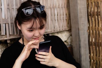 Young woman using smart phone
