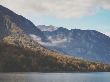 Scenic view of lake and mountains against sky