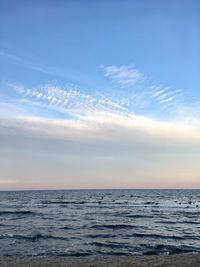 Scenic view of sea against blue sky