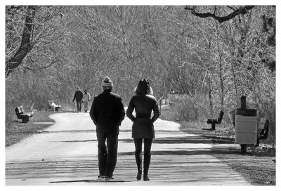 Blurred motion of people walking on road