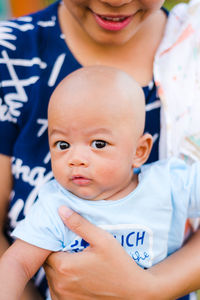 Close-up of mother holding cute son