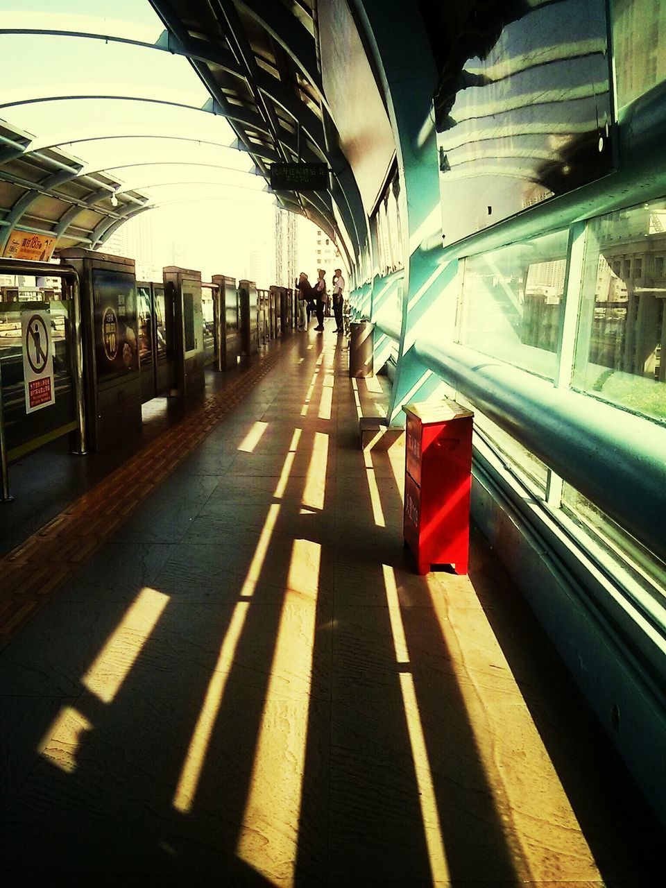 transportation, railroad station platform, railroad station, public transportation, rail transportation, railroad track, the way forward, mode of transport, travel, incidental people, indoors, subway station, diminishing perspective, on the move, built structure, train - vehicle, road marking, architecture, railway station, public transport