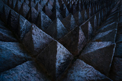Sharp tip concrete architecture texture background. art picture of unique pattern of dark stone.