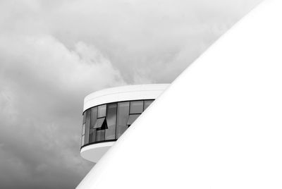 Low angle view of built structure against cloudy sky