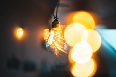 Close-up of illuminated light bulb