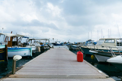 Boats moored at harbor