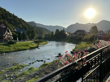 Scenic view of river against sky during sunset