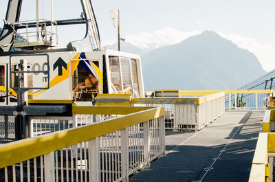 Overhead cable car station against sky