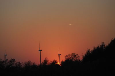 Silhouette of trees against sky during sunset