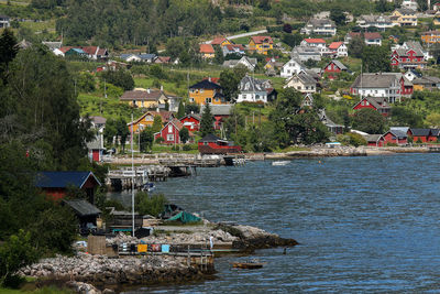 Aerial view of townscape by sea