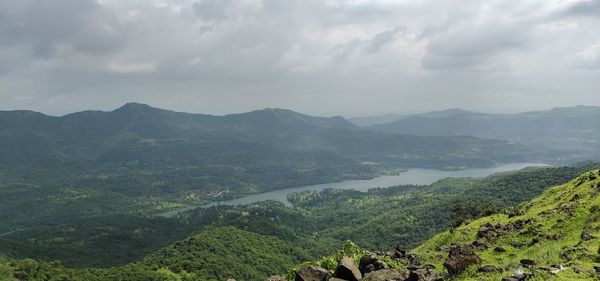 Scenic view of landscape and mountains against sky