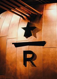 Close-up of information sign on wall